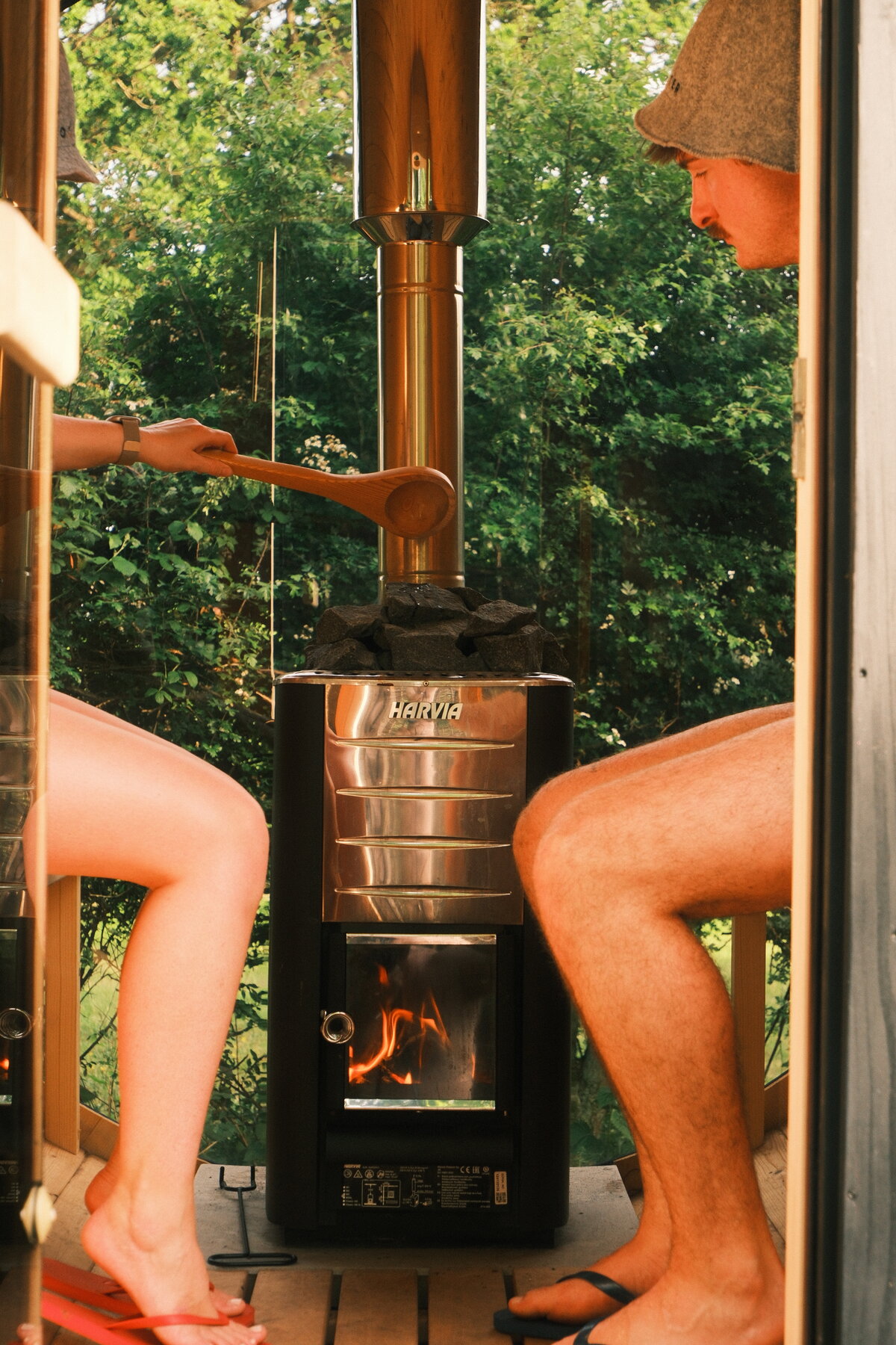 Ladling water over the sauna stones